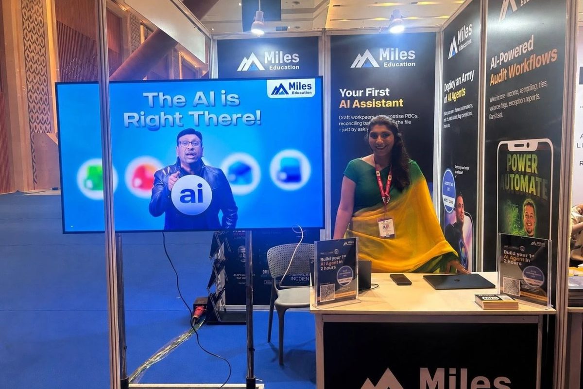 Saudamini in a green and yellow sari at the Miles Education stall at the ICAI AI Innovation Summit 2026