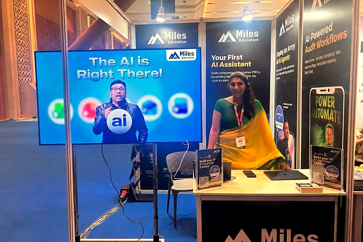 Saudamini in a green and yellow sari at the Miles Education stall at the ICAI AI Innovation Summit 2026